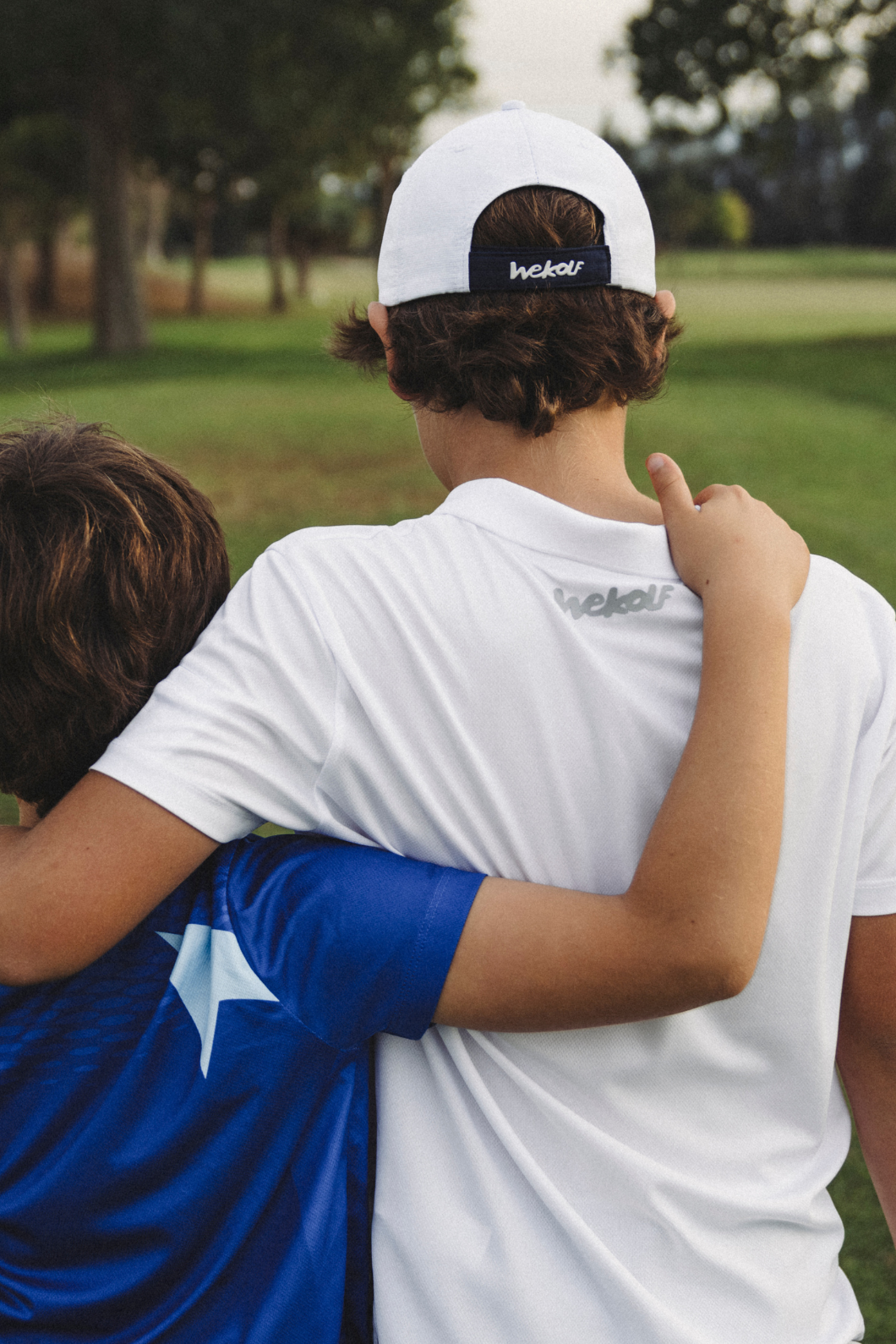 White golf polo shirt with geometric print for boys