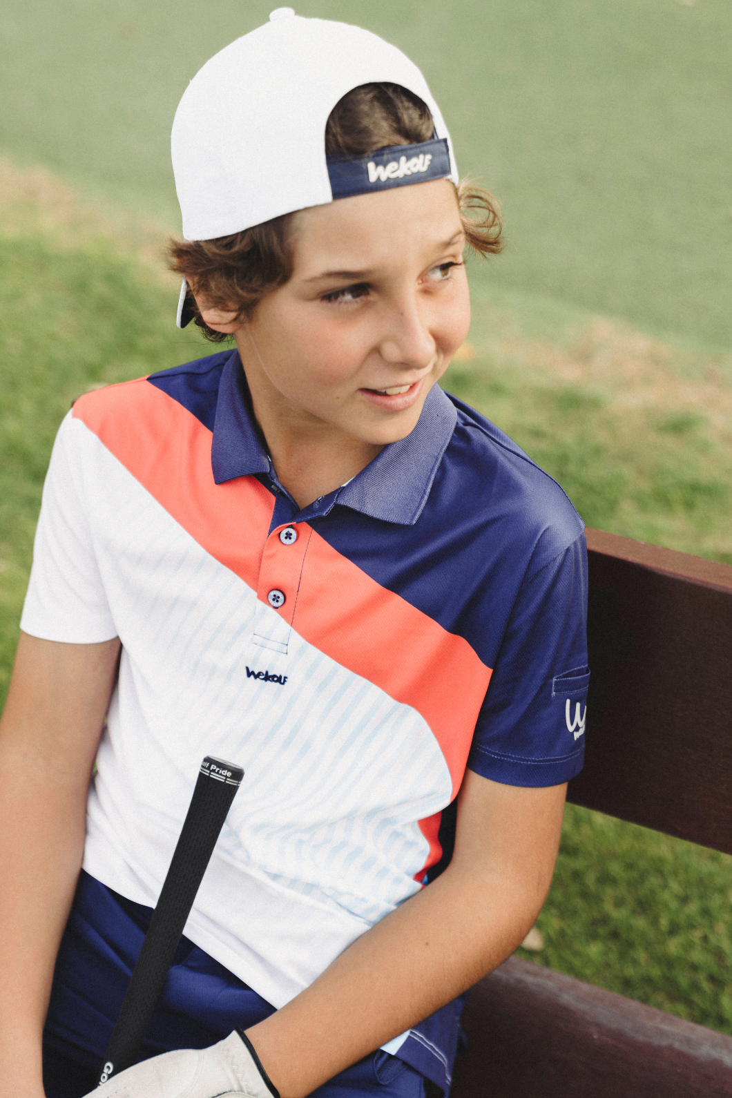Golf polo shirt in blue and coral colourblock for boys
