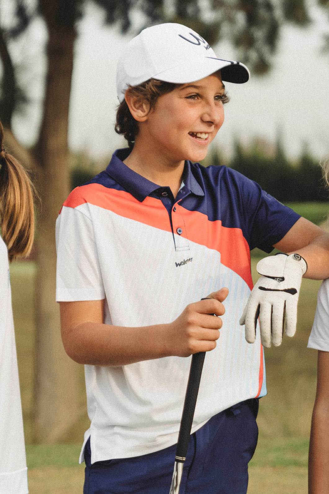 Golf polo shirt in blue and coral colourblock for boys