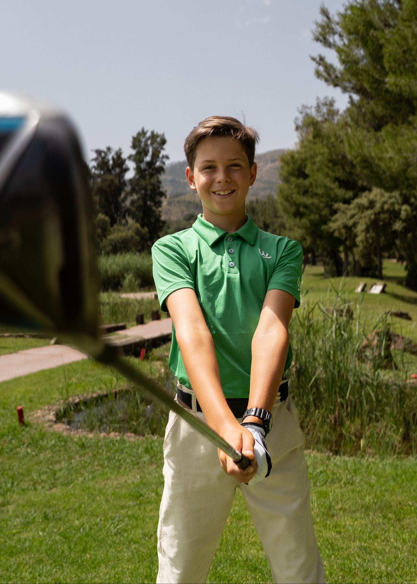 Polo de golf verde para niño
