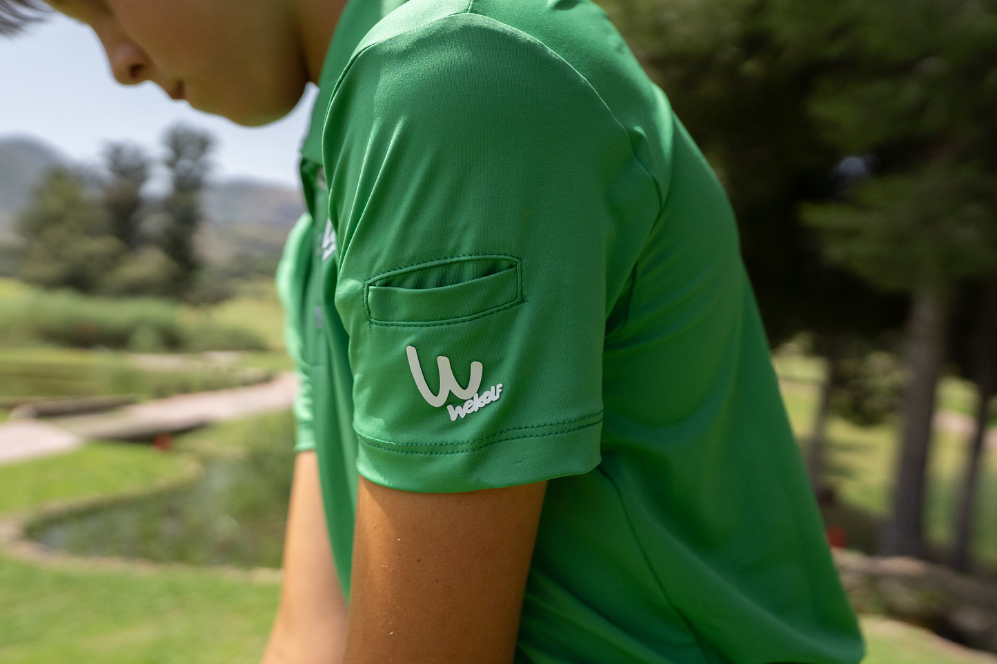 Polo de golf verde para niño