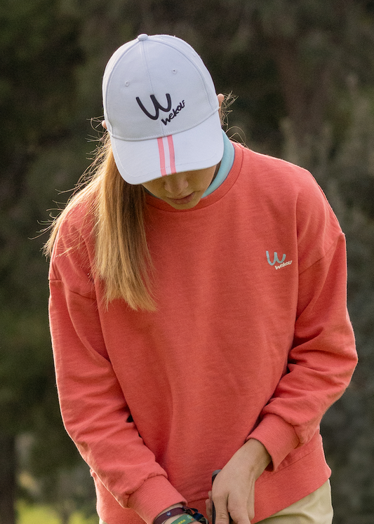 Gorra de golf blanca con detalle rosa para niña